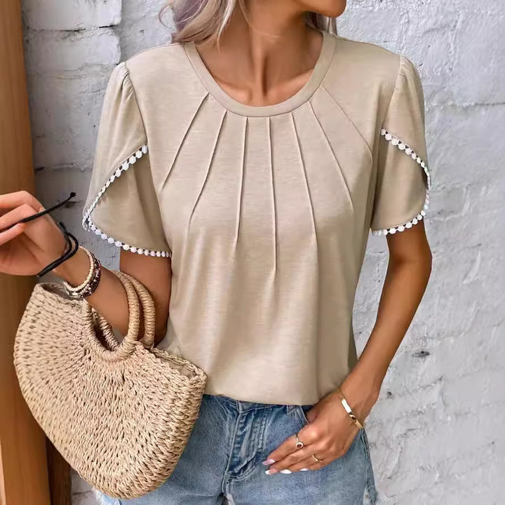 Women's round neck shirt with decorative pleated front, flutter sleeves and pompom trim StylebySassy