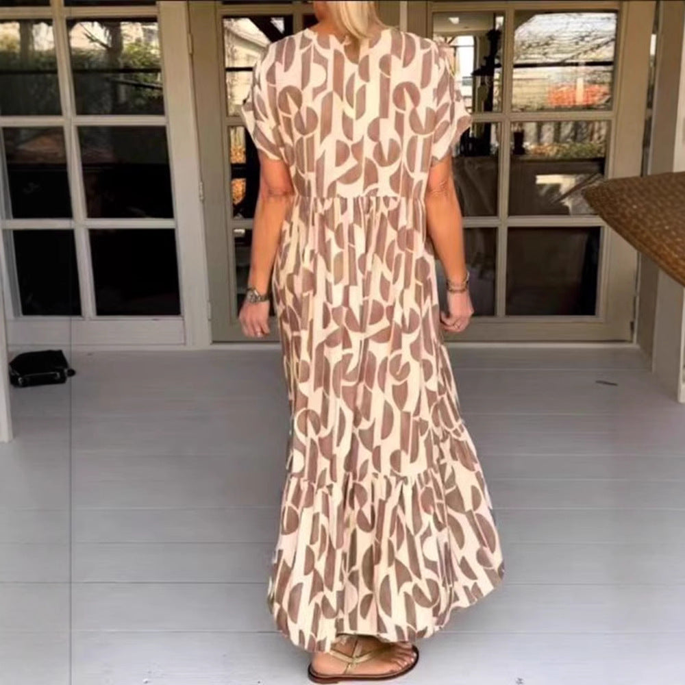 Women's voluminous maxi dress with under-bust seam, V-neck, short kimono sleeves, and tiered ruffle StylebySassy
