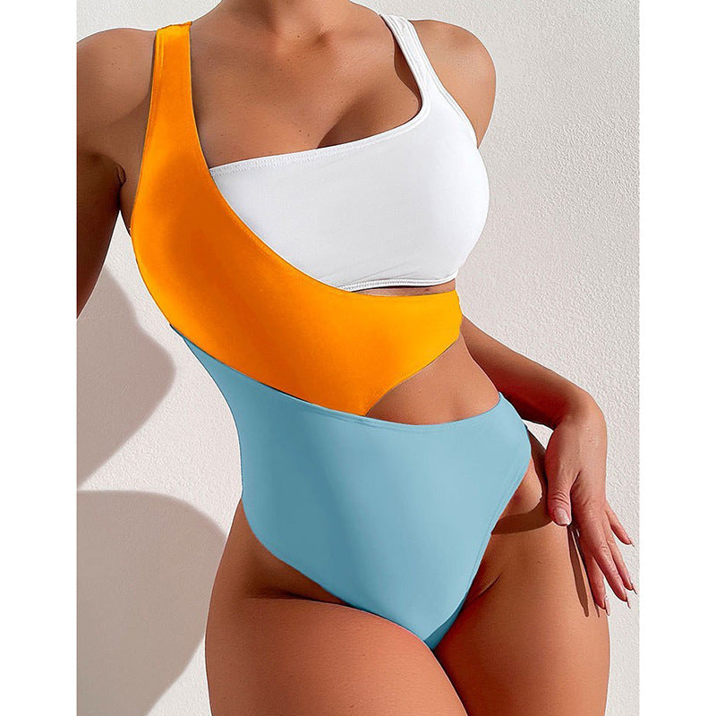 Women's one-piece swimsuit with asymmetric design and colorful contrast areas StylebySassy