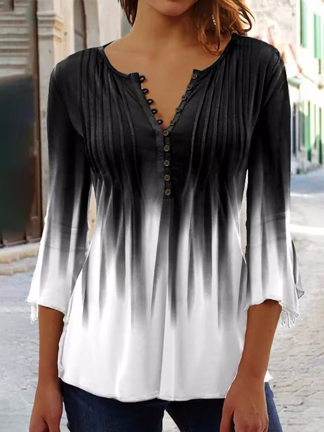 Women's airy tunic blouse with fine pleat yoke, half button placket, and three-quarter bell sleeves StylebySassy