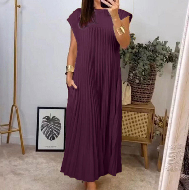 Women's flowing pleated maxi dress with dropped shoulders and side pockets StylebySassy