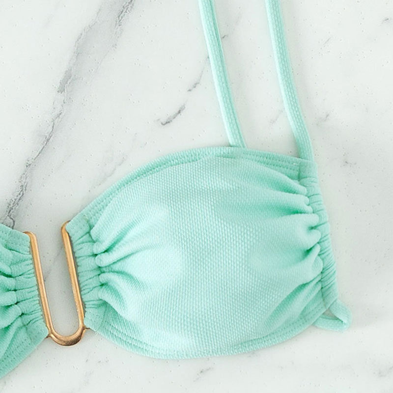 Women's bikini set with modern ruffle details and elegant golden accent StylebySassy