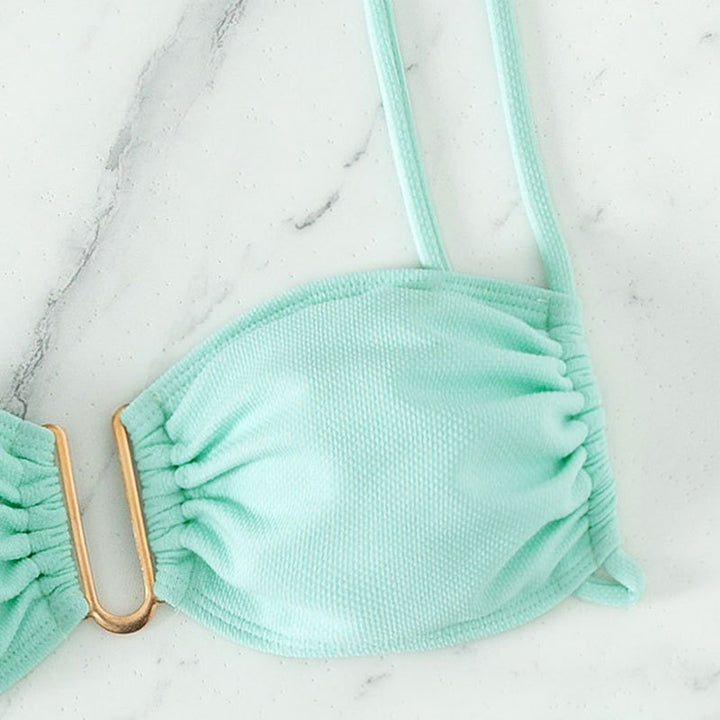 Women's bikini set with modern ruffle details and elegant golden accent StylebySassy