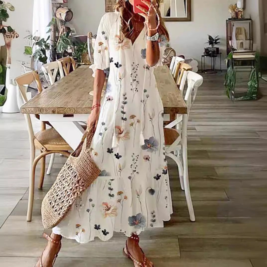 Women’s airy maxi dress in A-line with V-neck, casual rolled sleeves and floral all-over print StylebySassy