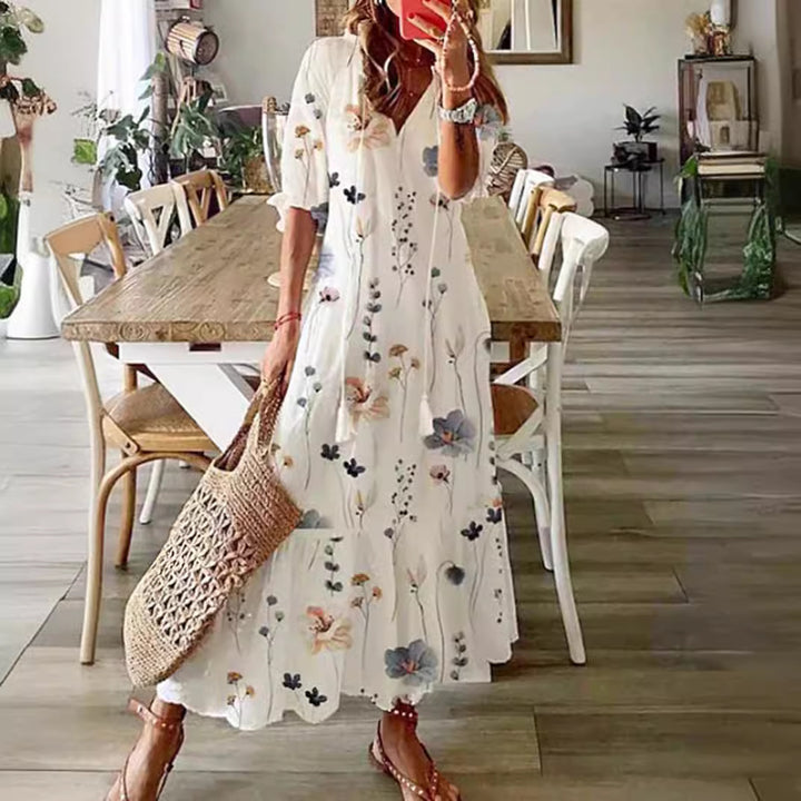 Women’s airy maxi dress in A-line with V-neck, casual rolled sleeves and floral all-over print StylebySassy