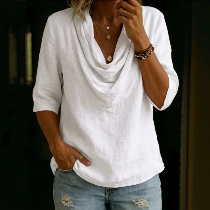 Women's airy linen blouse with draped waterfall collar, loose silhouette, and three-quarter sleeves StylebySassy