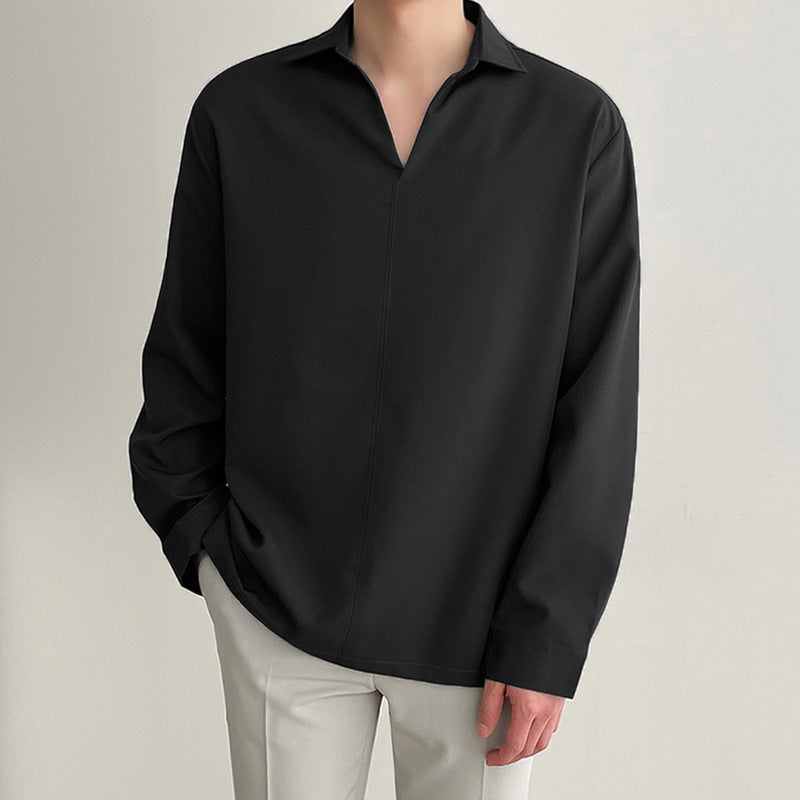 Women's loosely cut tunic blouse with deep V-neck, concealed button placket, and dropped shoulders StylebySassy