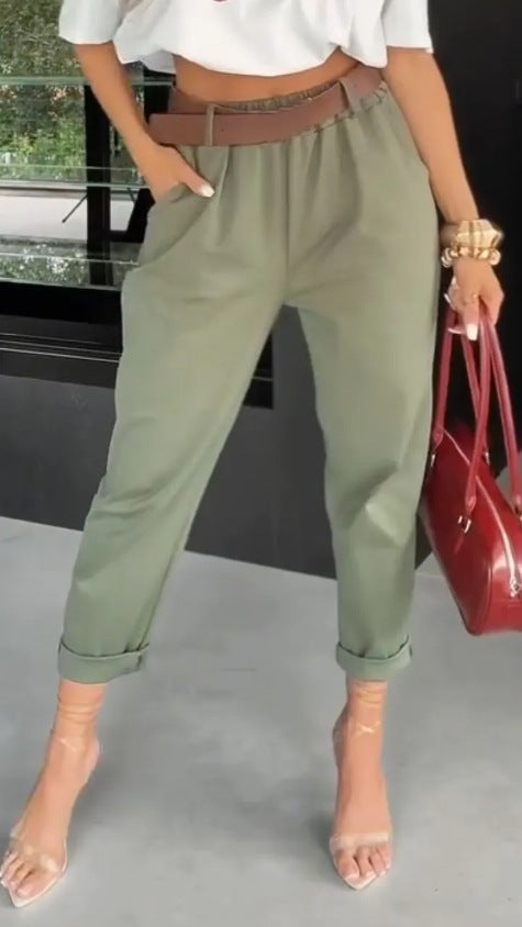 Women's high-waisted paperbag pants with gathered waistband, side pockets, and rolled hem StylebySassy