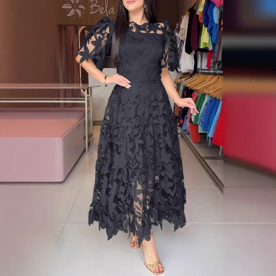 Women's maxi dress made of floral guipure lace with a fitted silhouette and tiered hem StylebySassy