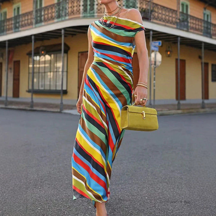 Women's asymmetrical off-shoulder maxi dress with diagonal stripe pattern and fitted silhouette StylebySassy