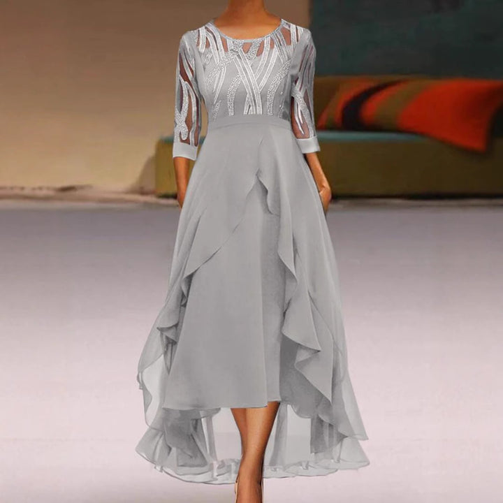 Women's elegant chiffon evening dress with embroidered tulle bodice, three-quarter sleeves, and asymmetric tiered hem StylebySassy