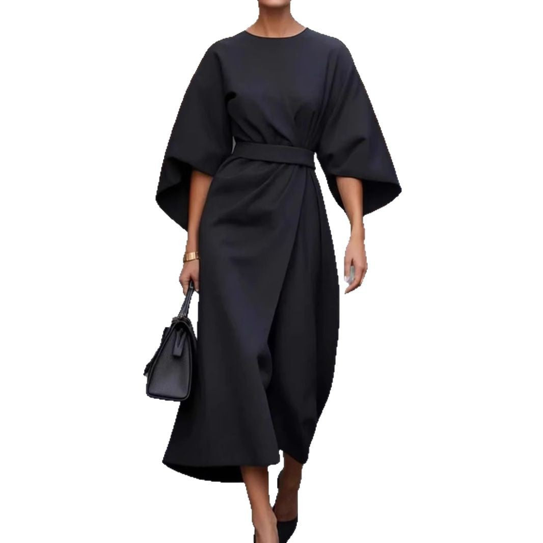 Women's minimalist evening dress with overlong wide sleeves and waist-sculpting pleat draping StylebySassy