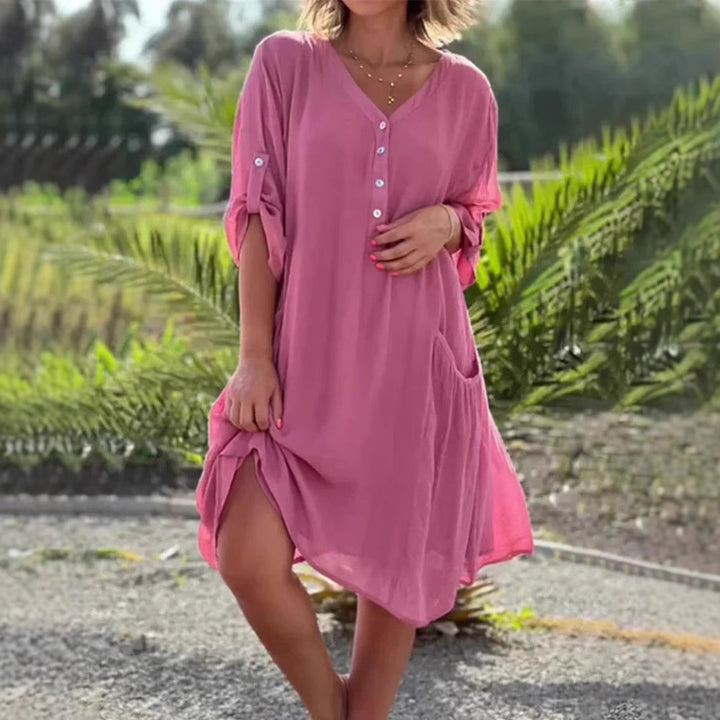Women's lightweight V-neck beach dress with button placket, rolled sleeves, and patch side pockets StylebySassy