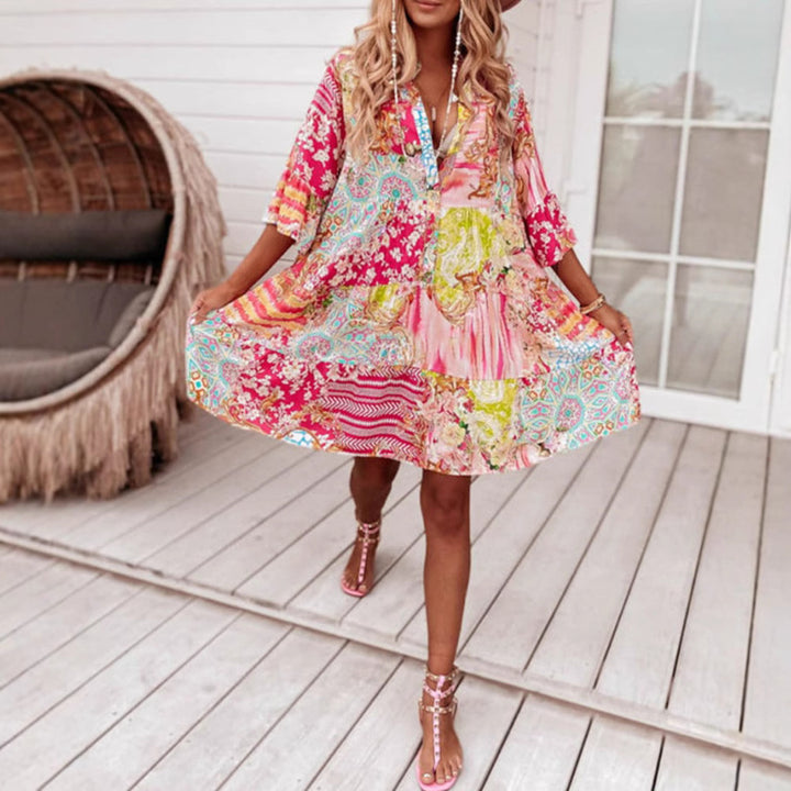 Ladies' airy tiered dress in patchwork boho style with stand collar, gathered waist seam, and three-quarter sleeves StylebySassy