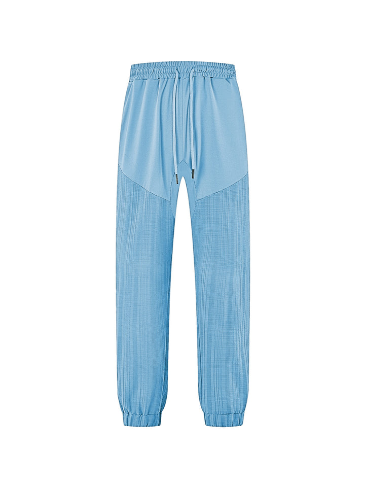 Men's slim-fit jogging pants with elastic drawstring waistband and textured knee panel StylebySassy