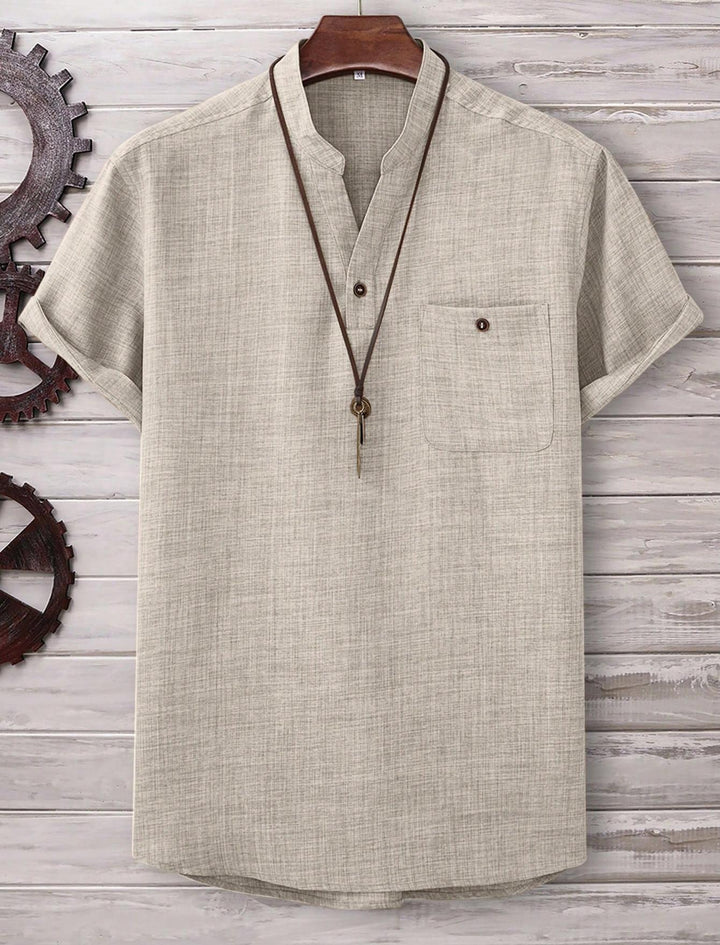 Men's casual Mandarin-style short-sleeve shirt with half-button placket, patch chest pocket, and rounded hem StylebySassy