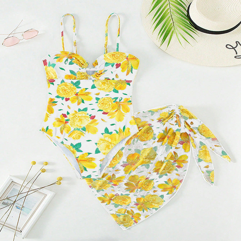 Women's one-piece swimsuit with floral design and matching overlay skirt StylebySassy