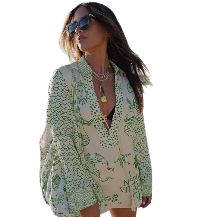 Ladies lightweight beach cover-up in tunic form with deep V-neck, tassel closure, and nautical ocean print StylebySassy