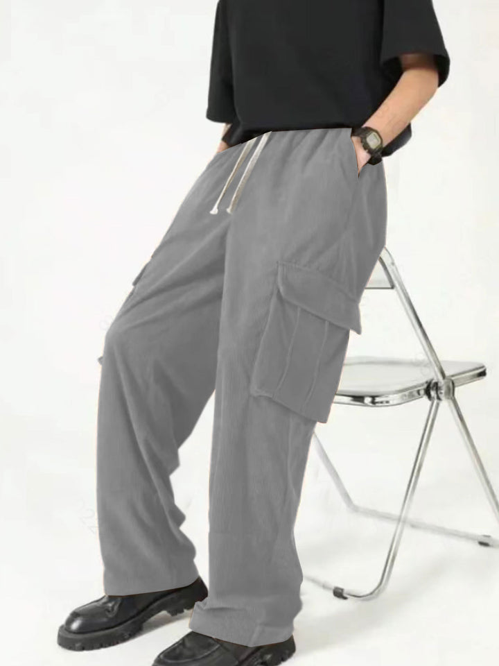 Men's loose wide corduroy cargo pants with drawstring waistband and large flap pockets StylebySassy