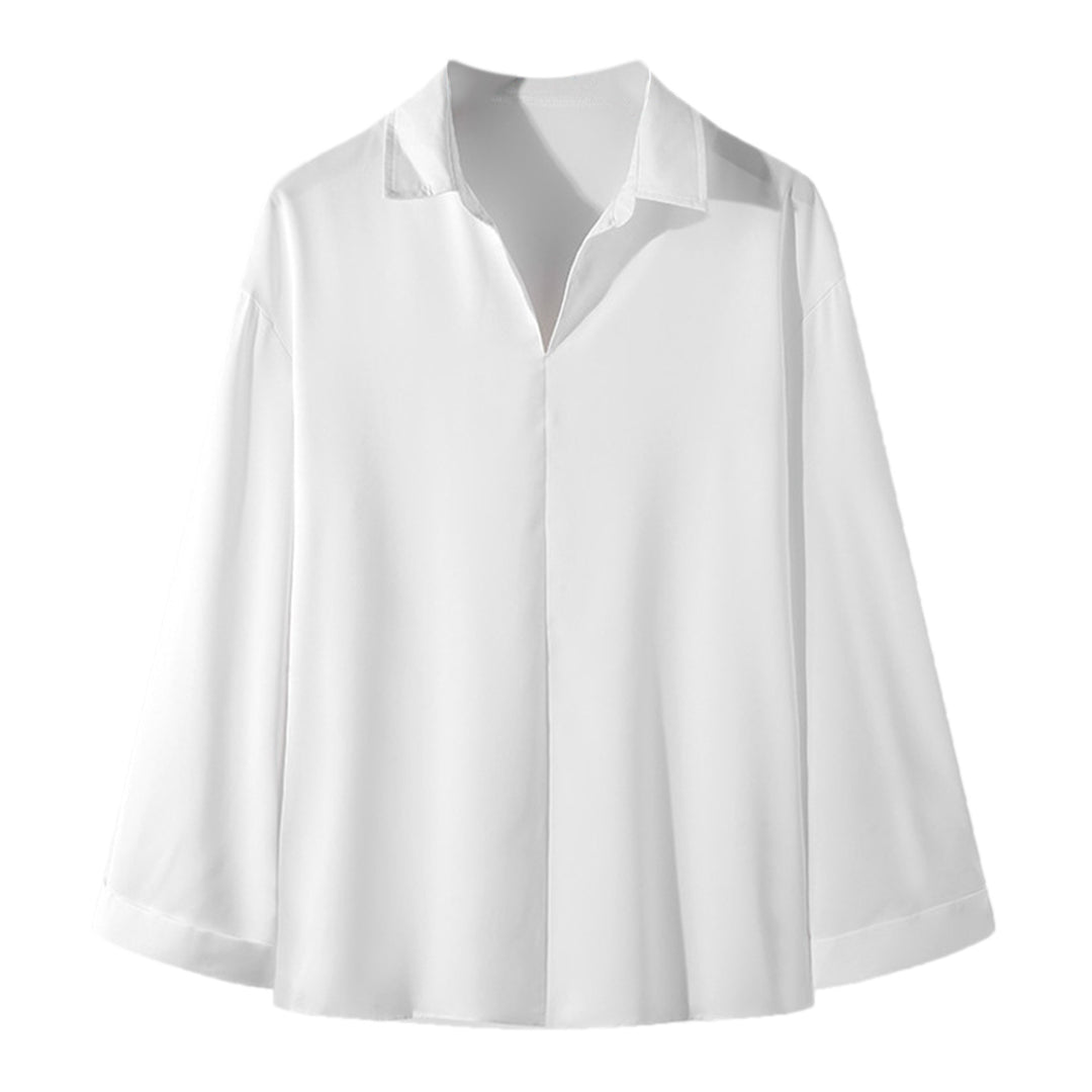 Women's loosely cut tunic blouse with deep V-neck, concealed button placket, and dropped shoulders StylebySassy