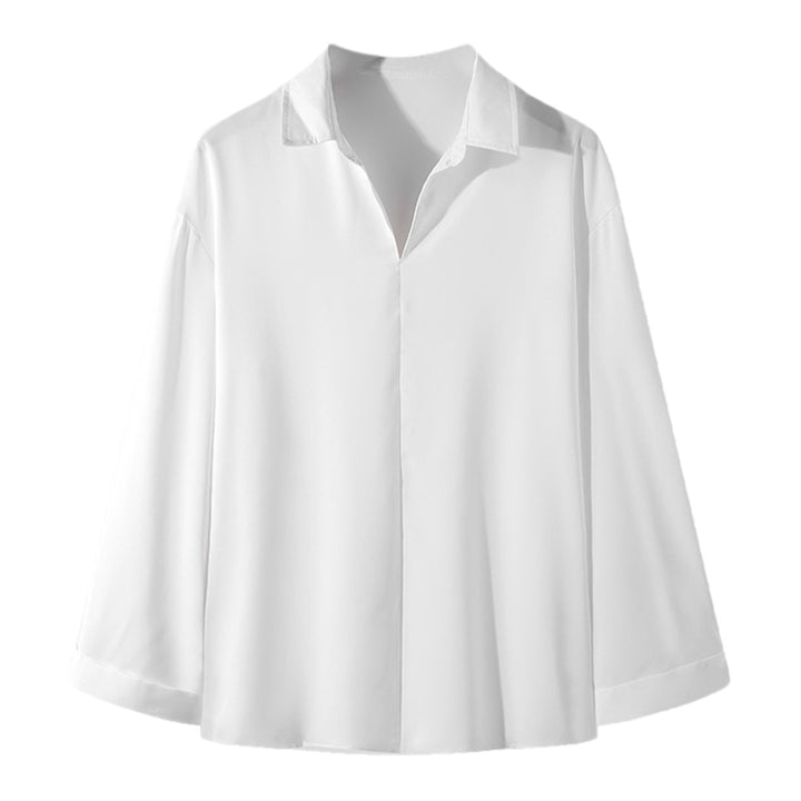 Women's loosely cut tunic blouse with deep V-neck, concealed button placket, and dropped shoulders StylebySassy