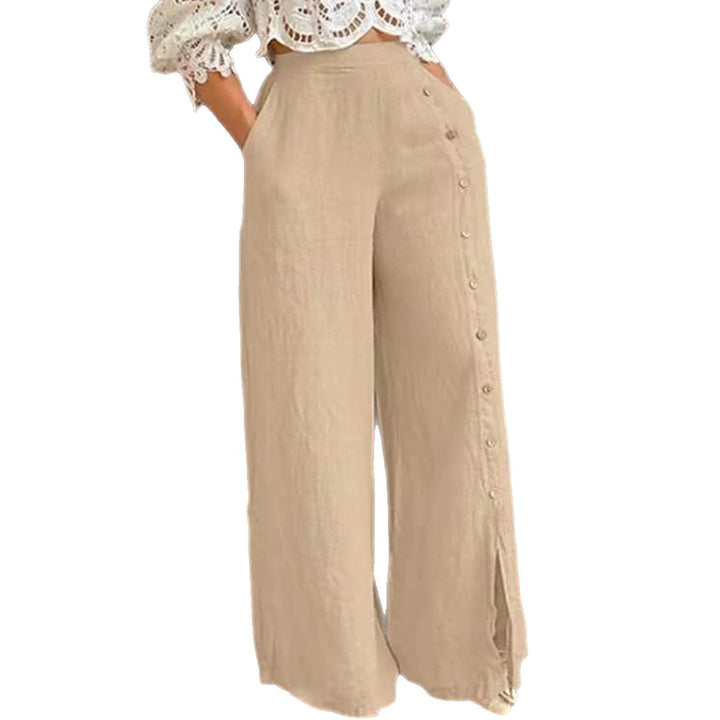 Women's high-waisted linen trousers with a side decorative button placket, side pockets, and wide leg cut StylebySassy