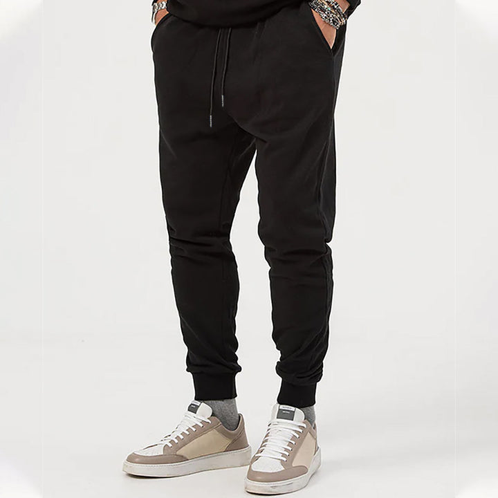 Men's jersey sweatpants in a tapered cut with concealed drawstring and shape-stable ankle cuffs StylebySassy