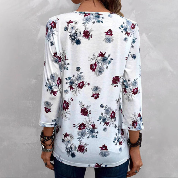Women's floral tunic blouse with pleats and decorative button placket StylebySassy