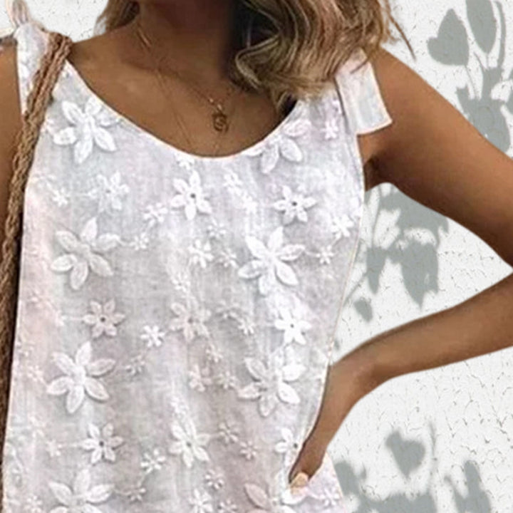 Women's lighter short overall with floral three-dimensional embroidery, adjustable tie straps and loose A-line silhouette StylebySassy