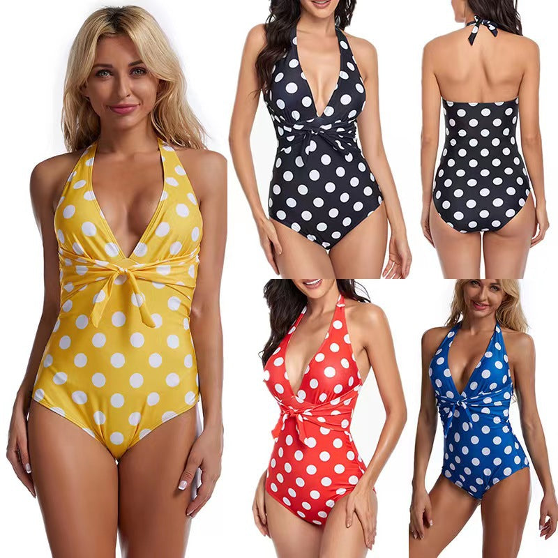 Ladies' one-piece swimsuit with flattering wrap design and stylish polka dots StylebySassy