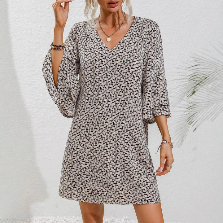 Women's flowing tunic mini dress with V-neck graphic chain pattern and double-layered bell sleeves StylebySassy