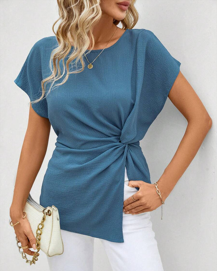 Women's fitted short sleeve draped shirt with side knot sling and textured crepe look StylebySassy