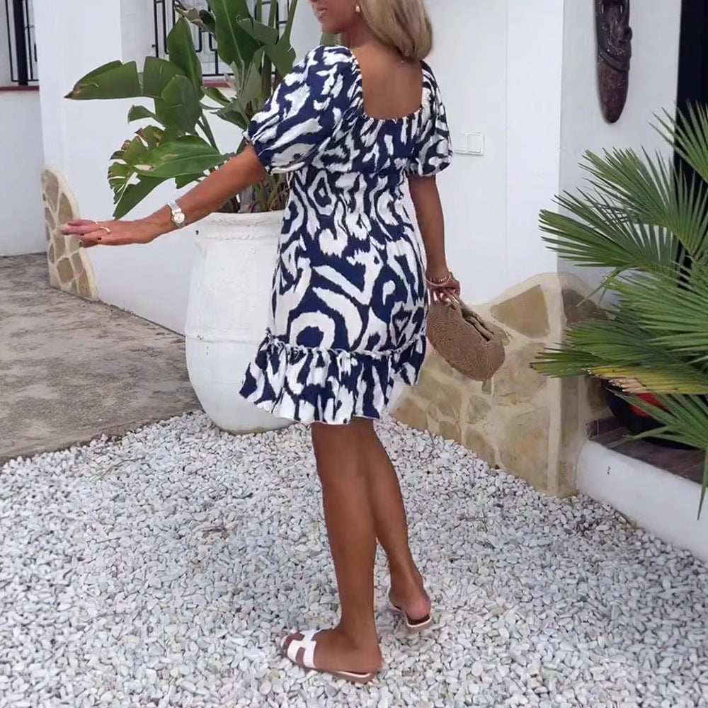 Women's short summer dress with square neckline, puff sleeves, and ruffle hem StylebySassy