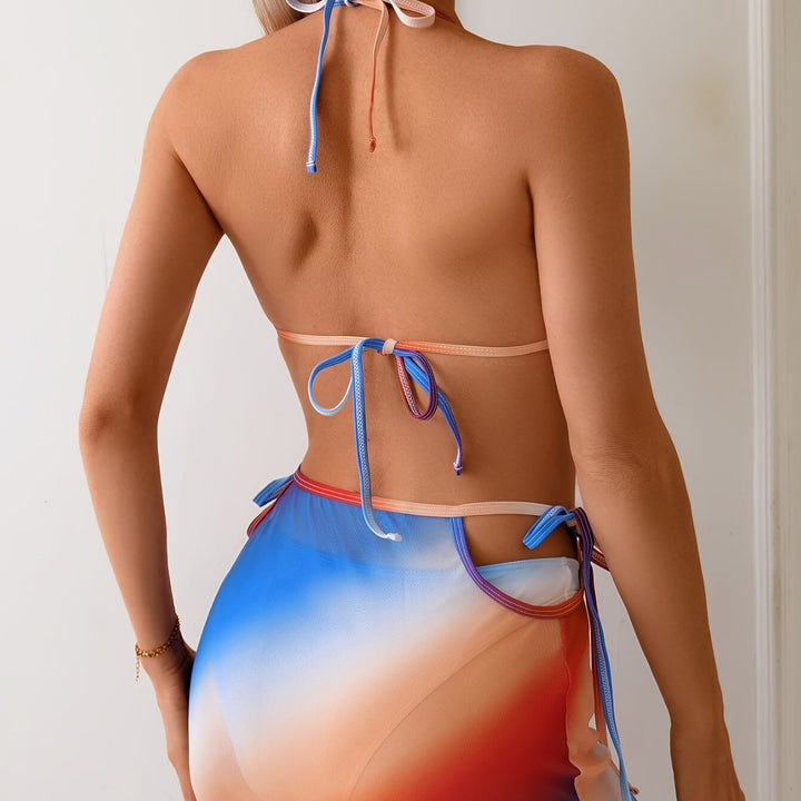 Women's triangle bikini with continuous color gradient and side wrap skirt StylebySassy