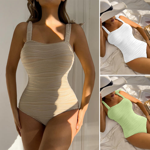 Women's figure-fitting one-piece swimsuit with playful bow details StylebySassy