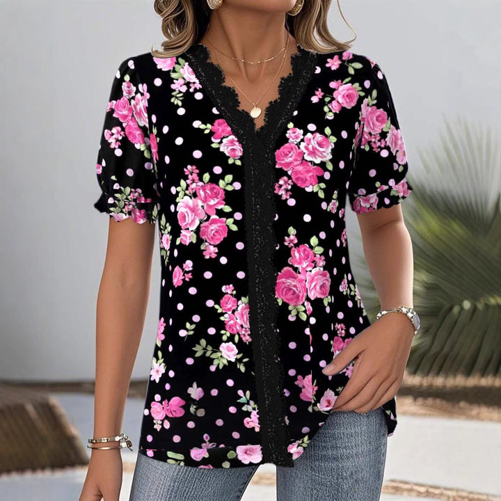Ladies floral V-neck blouse with decorative lace trim and gathered short sleeves StylebySassy