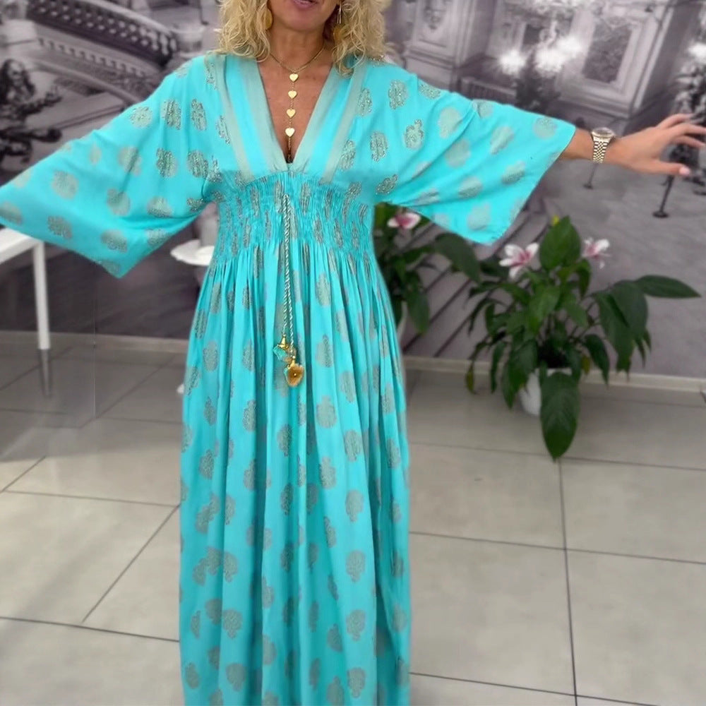 Women's gathered maxi dress with smocked waist, kimono sleeves, and decorative tassel StylebySassy