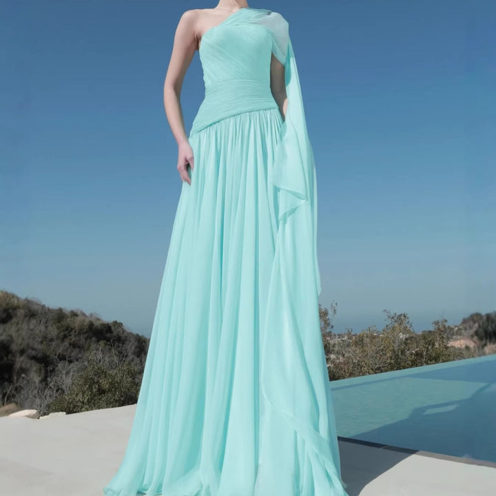 Women’s maxi dress with asymmetrical neckline and flowing fabric StylebySassy
