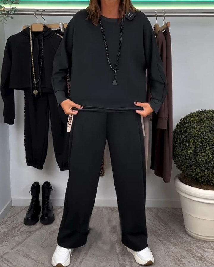 Women’s oversized jogging set with boxy sweatshirt and wide palazzo pants with decorative side stripe StylebySassy
