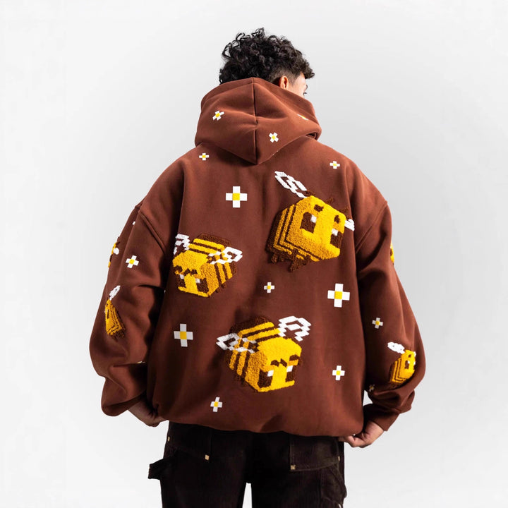 Unisex hoodie with woven pixel bee motif and attached kangaroo pocket StylebySassy