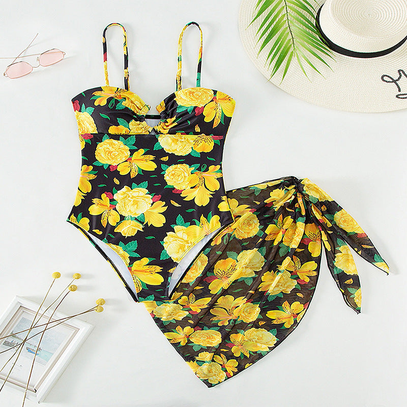 Women's one-piece swimsuit with floral design and matching overlay skirt StylebySassy