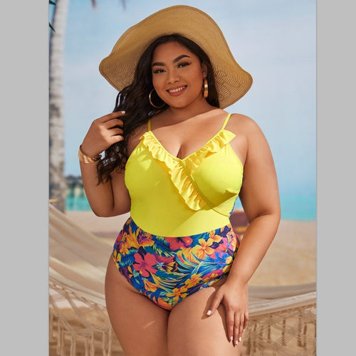 Women's one-piece swimsuit with asymmetrical ruffle design and floral pant area StylebySassy