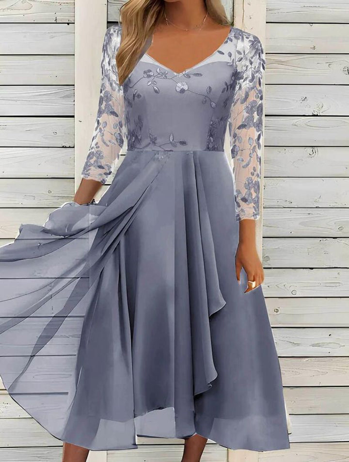 Women's V-neck chiffon midi dress with embroidered bodice, transparent three-quarter sleeves, and asymmetric layered skirt StylebySassy