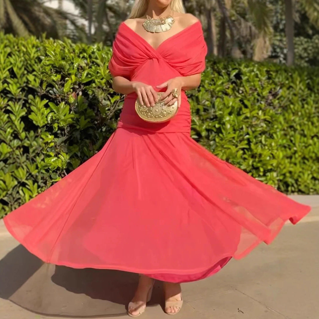 Ladies elegant floor-length evening dress with draped shoulder area and airy chiffon skirt StylebySassy