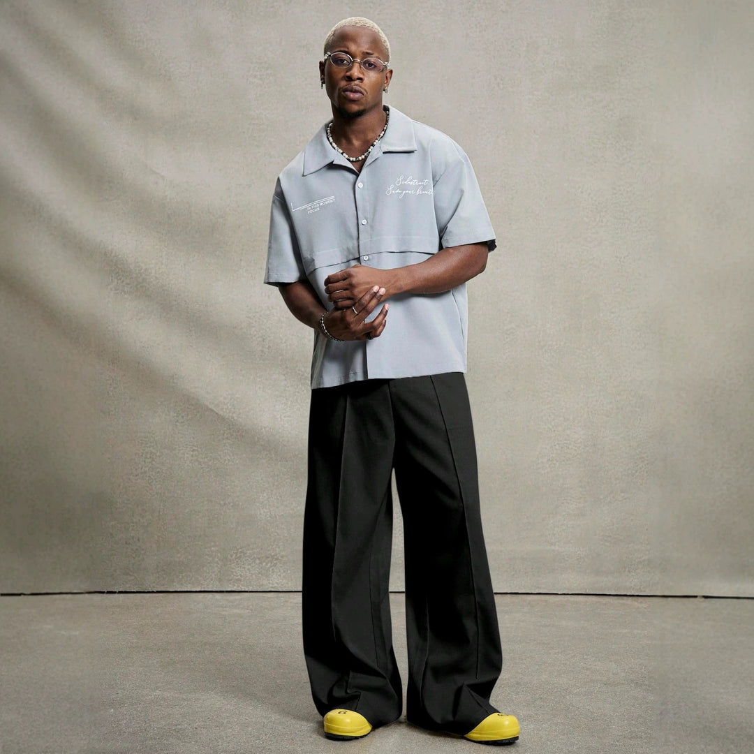 Men's wide pleated pants with high waistband, precise creases, and side inset pockets StylebySassy