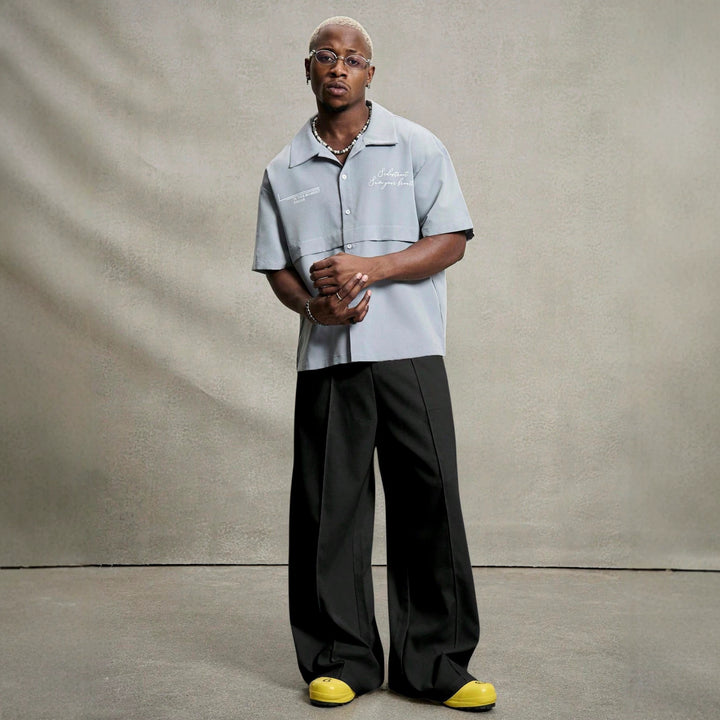 Men's wide pleated pants with high waistband, precise creases, and side inset pockets StylebySassy