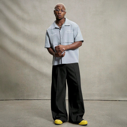 Men's wide pleated pants with high waistband, precise creases, and side inset pockets StylebySassy