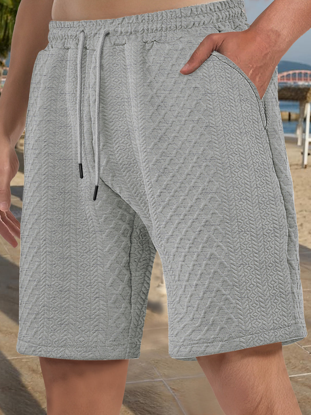 Men's textured beach bermuda shorts made of waffle jersey with elastic drawstring waistband and slanted pockets StylebySassy