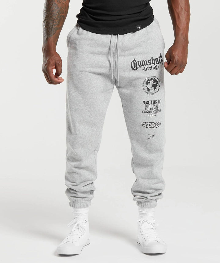 Men's tapered cotton fleece sweatpants with an elastic drawstring waistband, ribbed leg openings, and large logo print StylebySassy