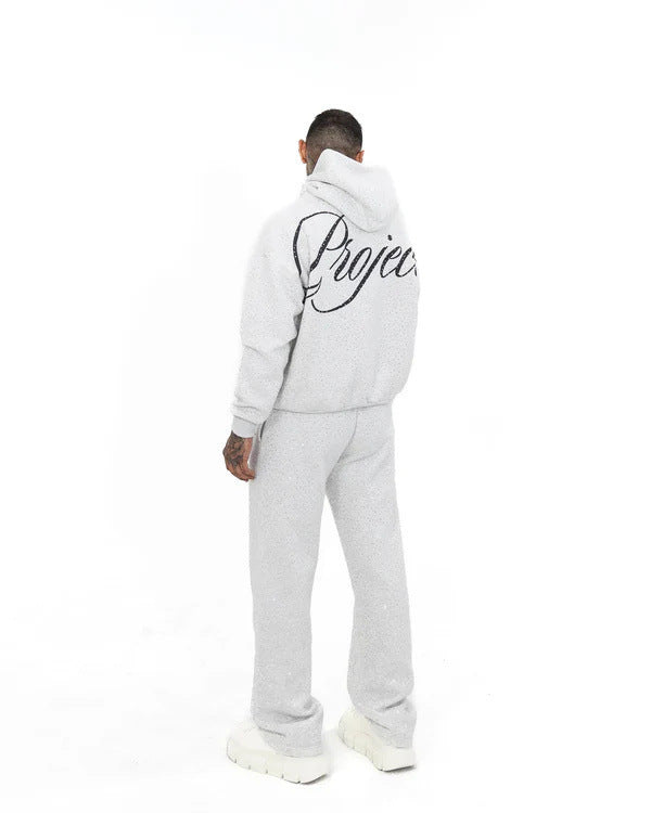 Men's wide comfort trousers with straight leg, elastic drawstring waistband, subtle logo embroidery, and fine speckled look StylebySassy